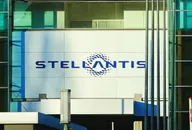 Stellantis logo displayed on the exterior wall of a modern office building with a glass facade.
