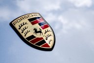 Close up detail logo of the rear of a Porsche 911.