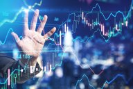 Tata Power share price forecast 2022-2025: Investing in future renewables? Stock market investment concept with businessman hand touching digital screen with forex chart indicators. Double exposure