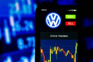 Volkswagen logo and a stock chart