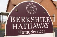 Berkshire Hathaway BRK-B ticker with shares price and charts under magnifying glass