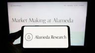 Alameda Research logo on smartphone and computer screen