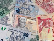 Nigeria money, heap of various naira banknotes, African nigerian currency