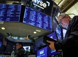Traders work on the floor of the New York Stock Exchange (NYSE) in New York City, U.S., March 29, 2023. 