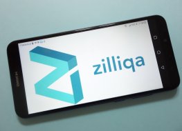 A smartphone displays the Zilliqa name and logo