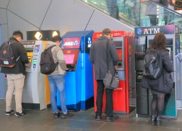 Unidentified people use ATM in Melbourne, Australia