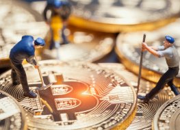 Miniature figures illustrate Bitcoin mining