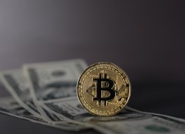 Bitcoin over dollar background