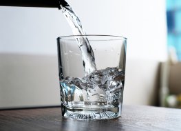 tap water pouring into glass