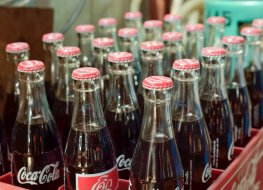 Investors push Coke's new green initiative Coca-Cola bottles