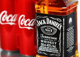 A image of a Coca-Cola can and a Jack Daniels bottle