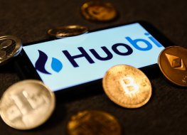 Huobi logo displayed on a phone screen and representation of cryptocurrencies are seen in this illustration photo taken in Krakow, Poland on 28 September, 2021