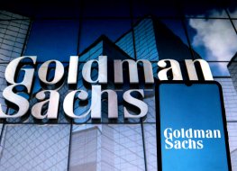  In this photo illustration a Goldman Sachs Group logo seen displayed on a smartphone with a Goldman Sachs Group logo in the background