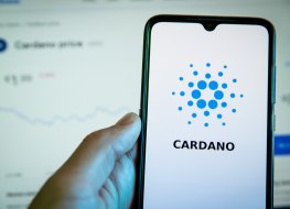 The Cardano logo and name are displayed on a smartphone