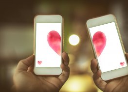 Photo of two smartphones forming heart