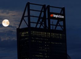 Moon rises of over the BHP building in Perth