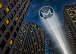  Monero cryptocurrency logo light beam projecting on a dark sky between skyscrapers