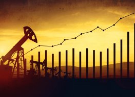 Oil prices are on the rise Image of financial chart against backdrop of an oil field