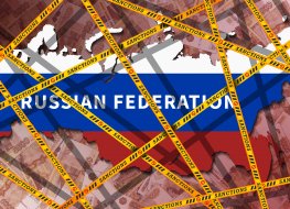 Yellow ribbons with the inscription 'sanctions' wrapped around the map of the Russian Federation, painted in the colours of the flag. Economic isolation of Russia concept. Banknotes 5000 rubles