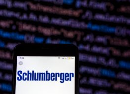 Schlumberger logo on mobile phone. Photo: Getty Schlumberger logo on mobile phone. Photo: Getty