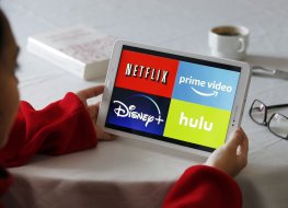 Tablet showing Netflix and Disney logos. Photo: Getty 