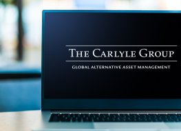 The Carlyle Group logo on a laptop computer