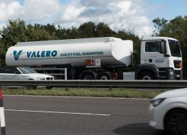 A Valero fuel truck on a highway in the UK.