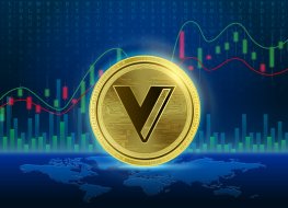 The VGX coin in front of a price graph