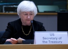 Janet Yellen, US Treasury Secretary, looks at her notes in front of a microphone 