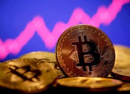 A representation of virtual currency Bitcoin is seen in front of a stock graph in this illustration taken January 8, 2021. A representation of virtual currency Bitcoin is seen in front of a stock graph in this illustration taken January 8, 2021.