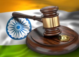 Bitcoin and judge gavel laying on flag of India. Bitcoin legal situation in India concept. 3D rendering