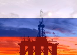 Oil platform at sea on the background of the Russian flag