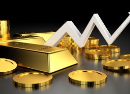 Rising graph amid gold coins and bars