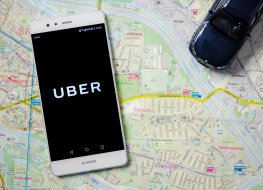 Uber stock forecast: Facing a surge in operational challenges? Uber logo on Huawei P9. Uber is sharing-economy service for ubran transport.