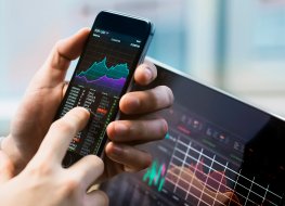 Trader trading on Nifty index via mobile handset