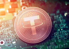 Tether coin on blue motherboard background
