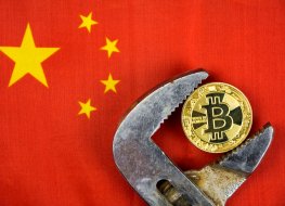 Bitcoin in a wrench on a Chinese flag 