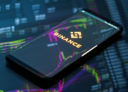 Binance logo on a phone