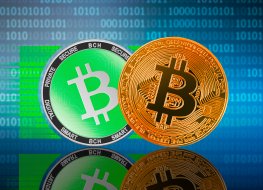 Bitcoin Cash (BCH) and Bitcoin (BTC) on the binary code background