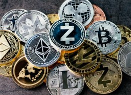 Coins with cryptocurrency logos.