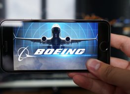 Los Angeles, California, USA - 06 July 2019.Logo of the North American company Boeing is displayed on the screen of the mobile device. Boeing and Brazil's Embraer are commercial partners in the field