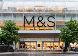 A Marks and Spencer store flanked by trees