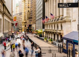 People walking on Wall Street