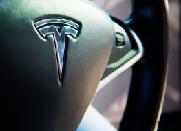 Tesla (TSLA) logo on steering wheel