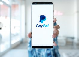 Woman hands holding Oneplus 6 with PayPal apps 
