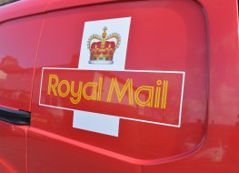 Royal Mail share-price forecast: Is there any upside ahead? A royal mail sign on the side of a red delivery van