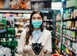 A woman shopping with a mask and empty purse