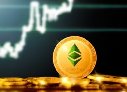 Gold ethereum coin on the background of a chart
