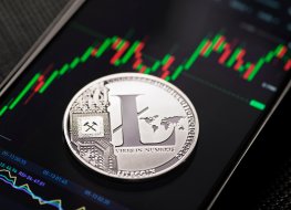 Silver litecoin cryptocurrency trading on smartphone close up