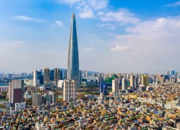 Jamsil, Songpa-gu, Seoul, South Korea - April 11, 2020: Aerial view of Lotte World Tower surrounded by houses and highrise apartments
